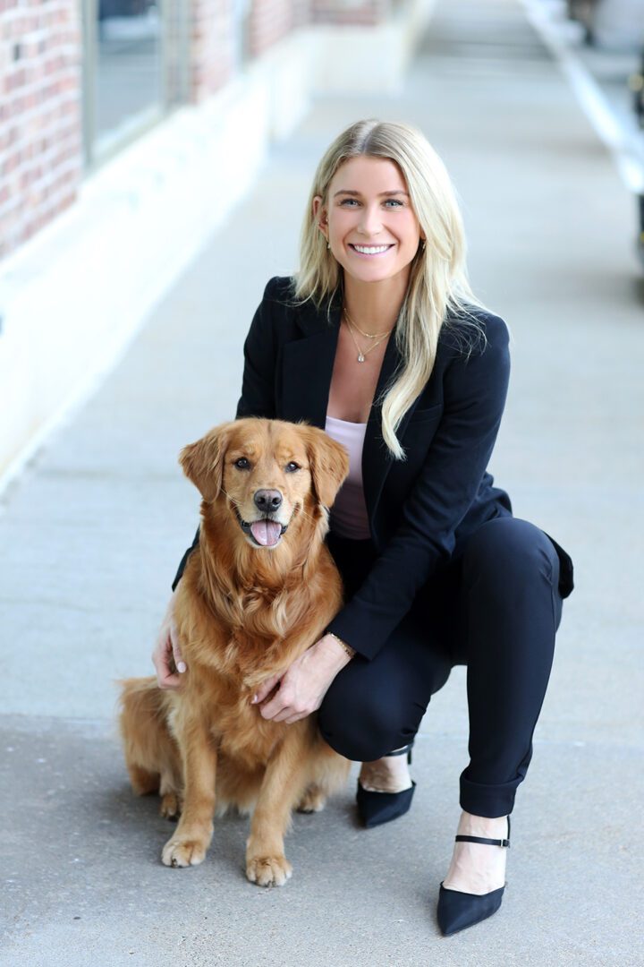 Doctor Allison Helget with therapy dog Harper