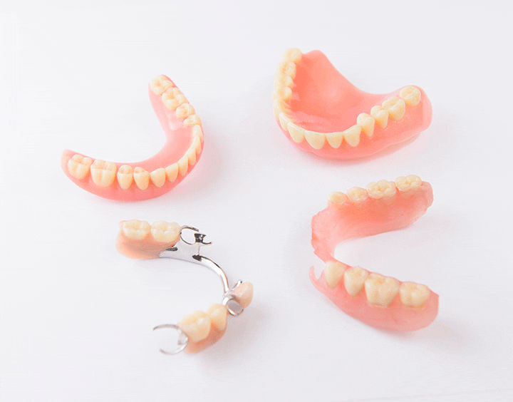 Group of dentures on white background