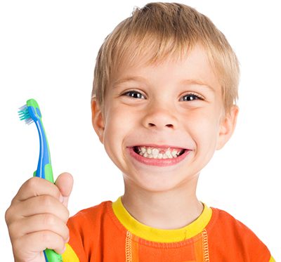 child holding toothbrush