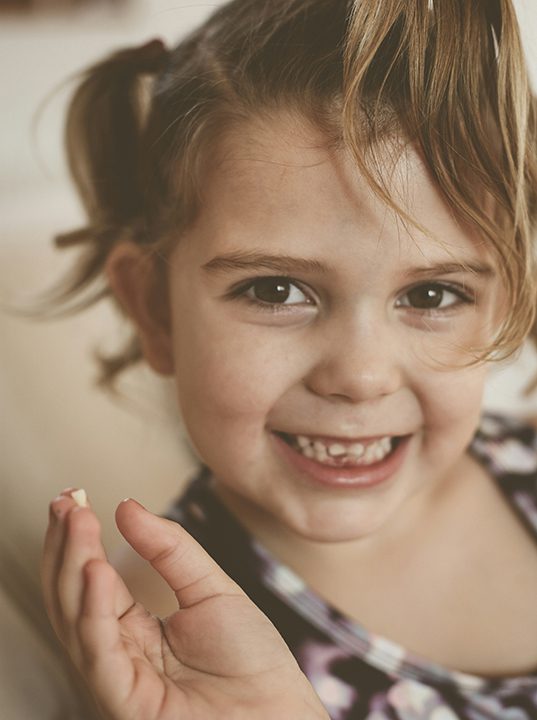 child with pulled tooth